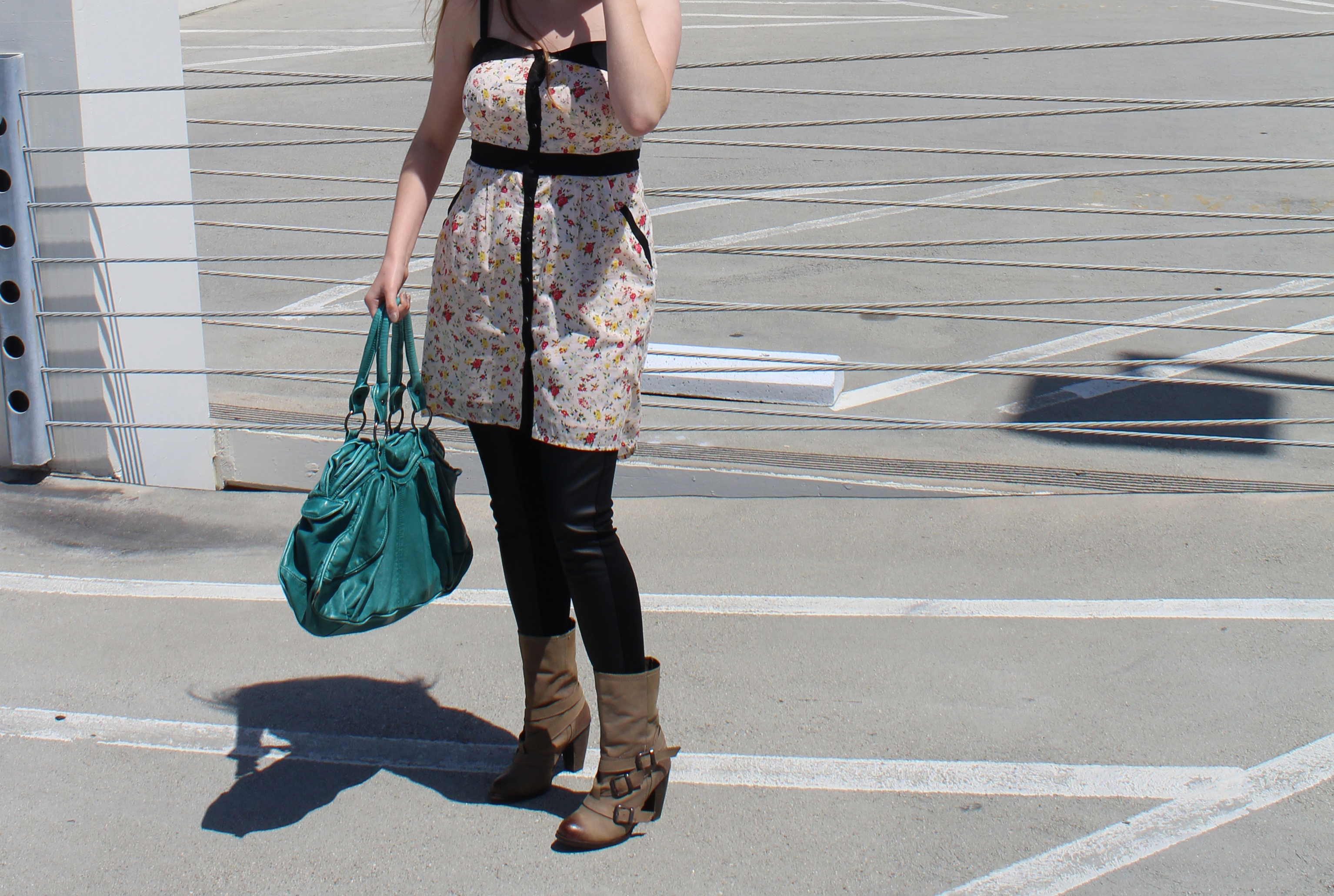 Floral dress by BCBGeneration, Vegan leather leggings from FACTORY by Erik Hart, boots by Steve Madden