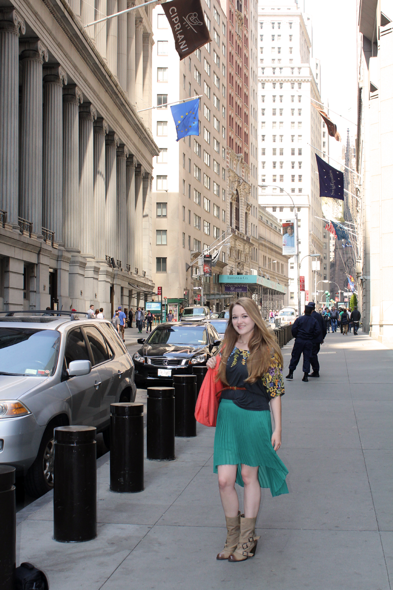 { pleated skirt by Zara, floral top by Deletta, bag by American Eagle, leather belt from Myne, boots by Steve Madden }